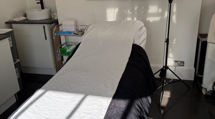 Treatment bed at MBA Aesthetics & Training in Southampton, England, GB, offering a serene wellness experience.