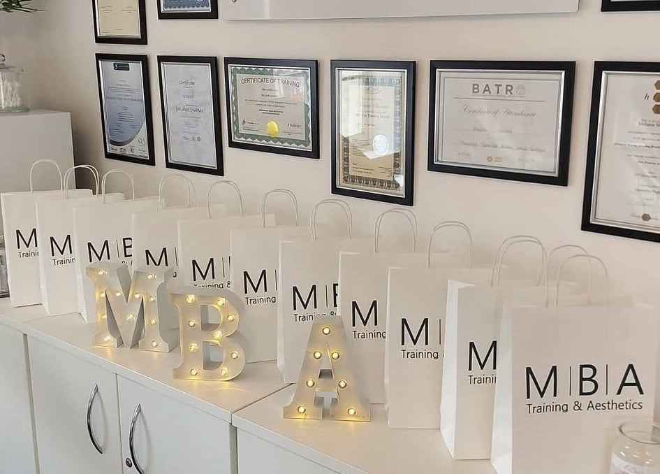 Certificates and gift bags at MBA Aesthetics & Training in Southampton, England, GB, showcasing professionalism.
