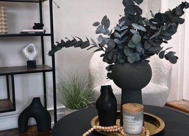Elegant decor at Upperhand Beauty, Ampthill, GB. Features chic vase, candle, and modern shelf design.