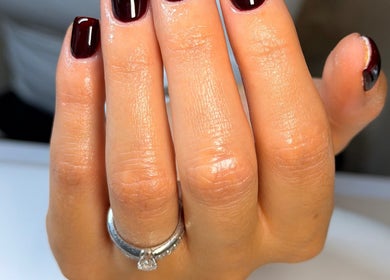 A chic, dark red manicure at Upperhand Beauty, Ampthill, GB showcasing elegant nail art.