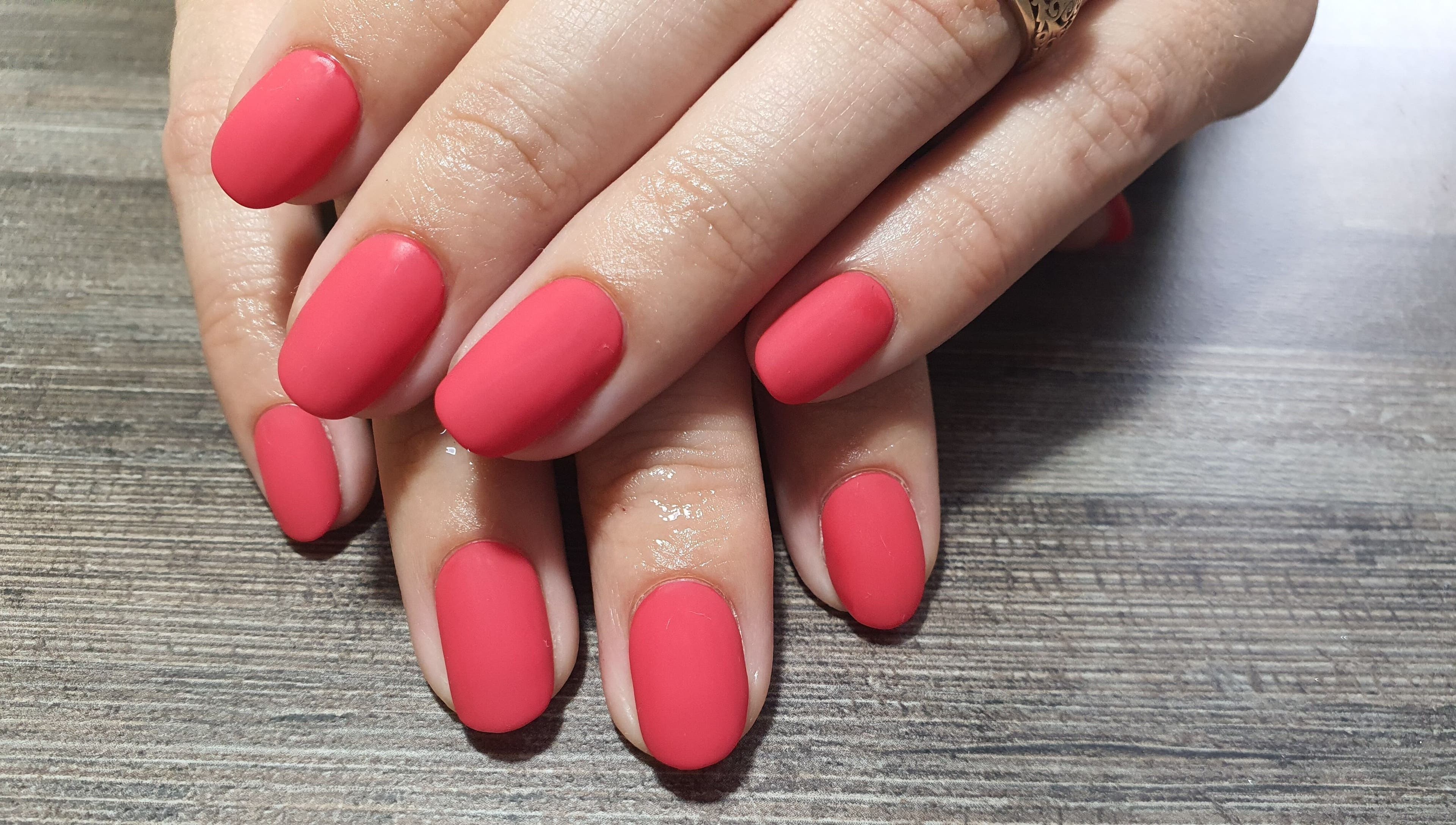 Stylish manicured red nails at Get Nailed Beauty Salon at Eclipse, Bloemfontein, Free State, ZA.