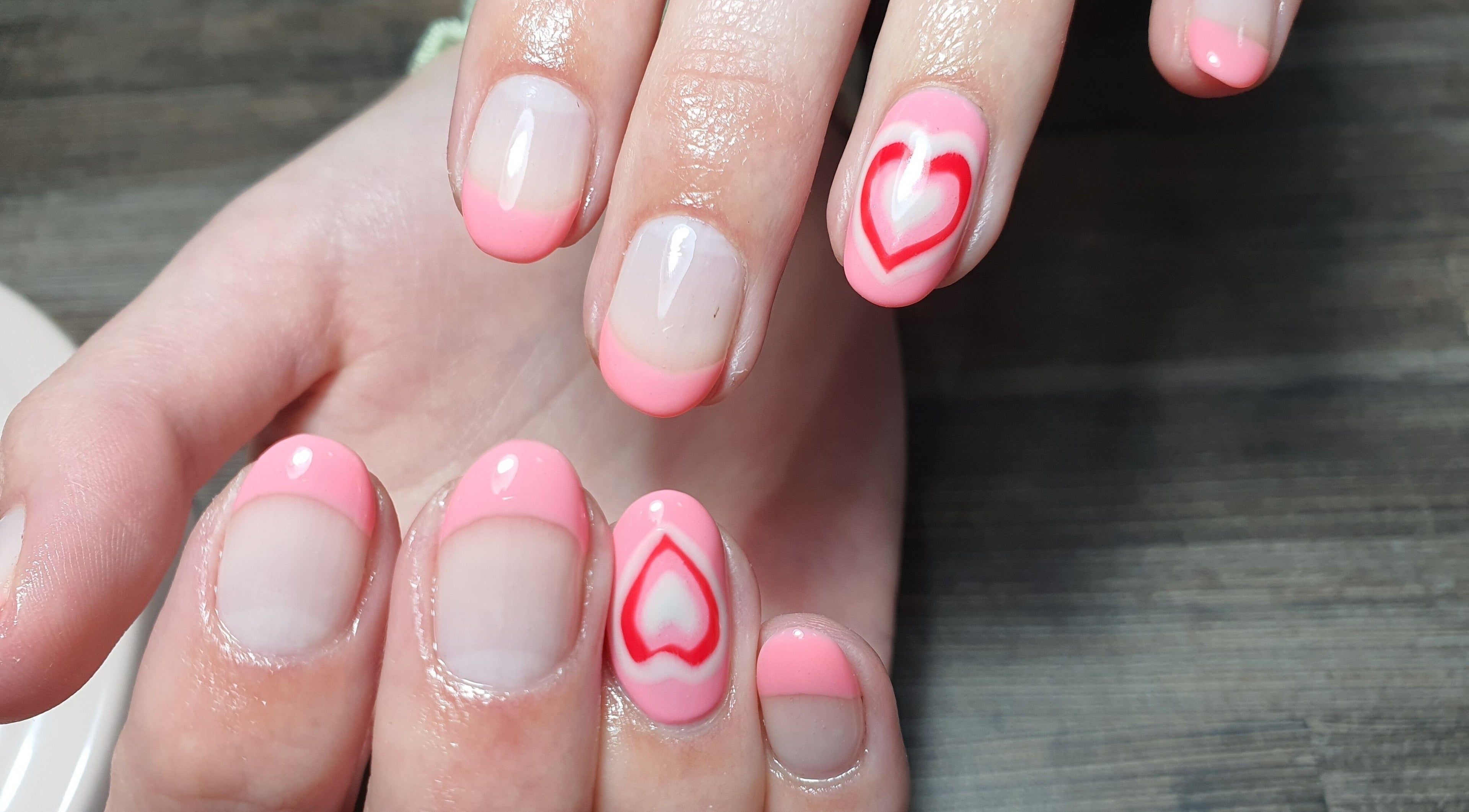 Elegant pink manicure with heart design at Get Nailed Beauty Salon in Bloemfontein, Free State, ZA.