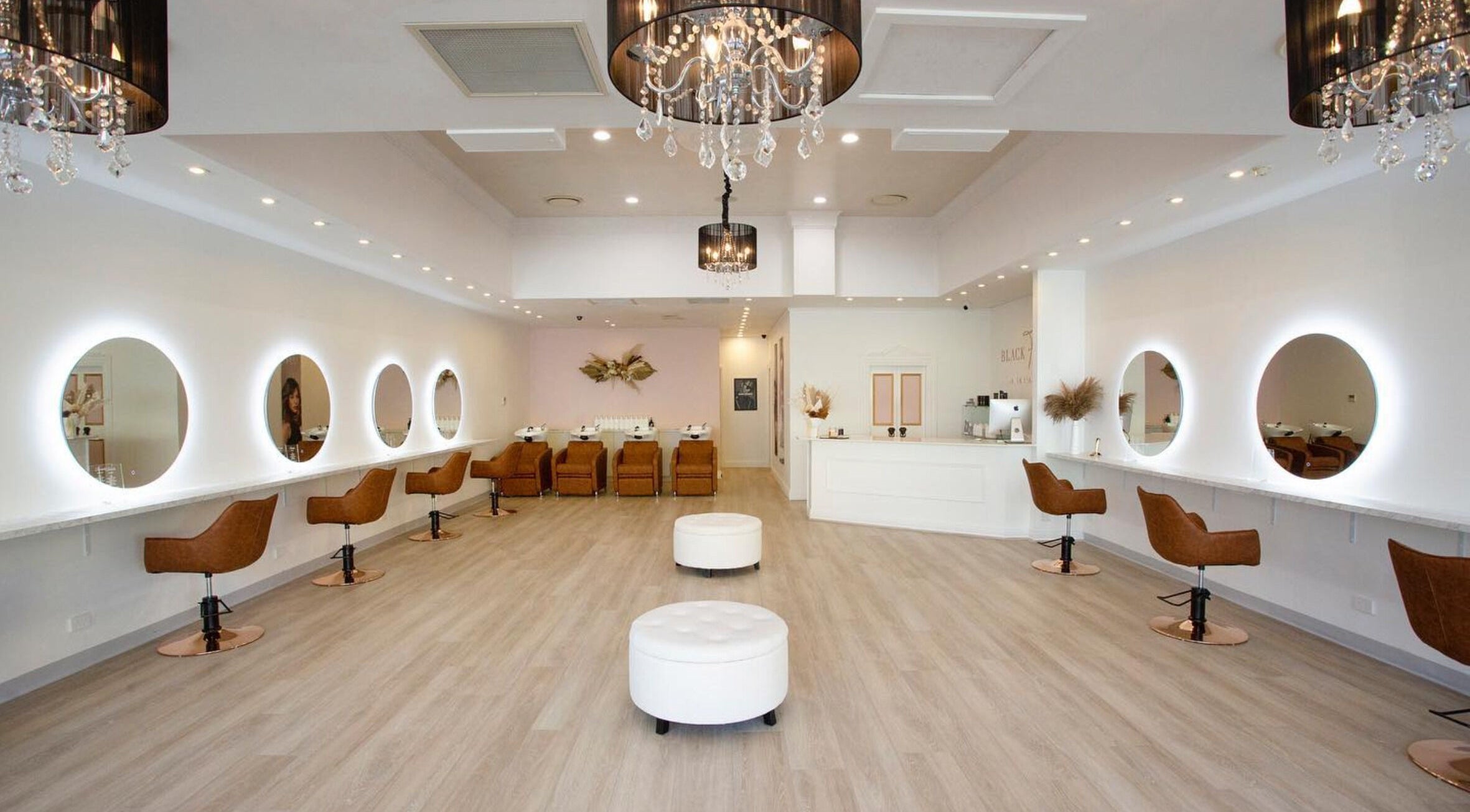 Elegant interior of Black Foxx Hair and Beauty in Charlestown, New South Wales, with chic design and seating.