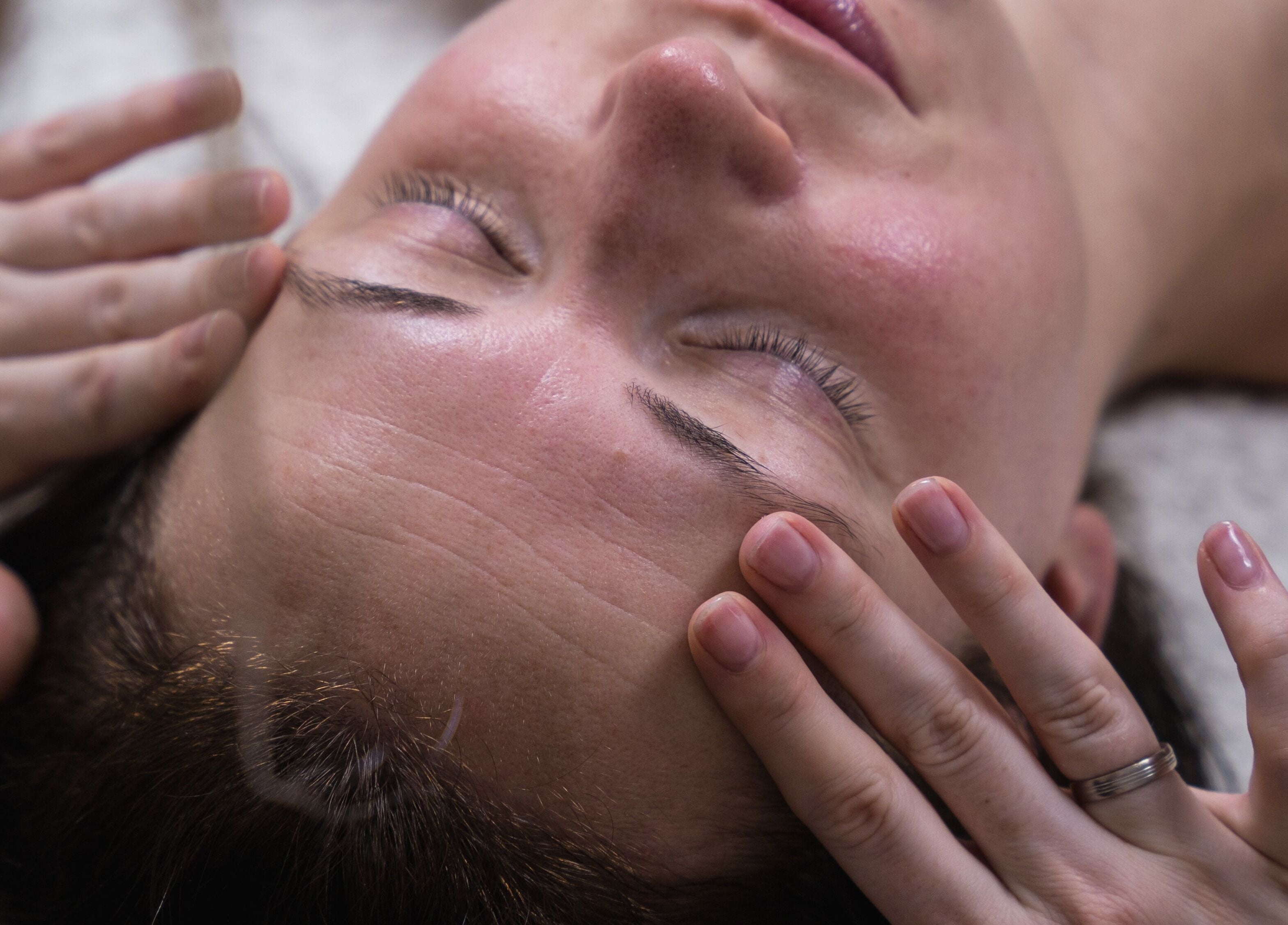 Calming facial massage at Victoria Mac Skin in Carshalton, England, GB, showcasing serene wellness experience.