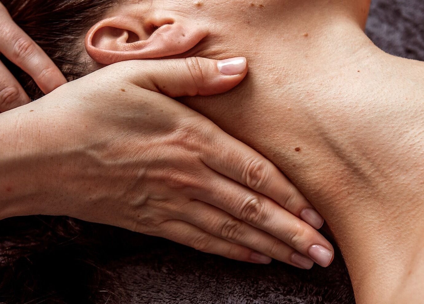 Close-up of a neck massage at Victoria Mac Skin, Carshalton, England, GB.