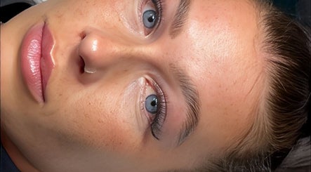 Close-up of a serene face receiving a beauty treatment at SLC Studio in Ash Green, England, GB.