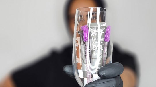 A gloved hand holds beauty tools at Lashcore | Rondebosch East in Cape Town, Western Cape, ZA.