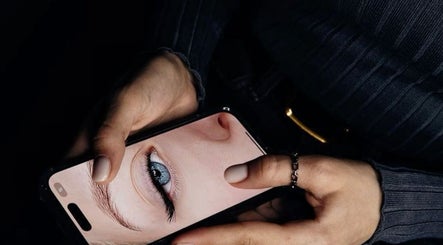 Closeup of a phone displaying an eye, highlighting beauty treatments at Lashcore | Rondebosch East, Cape Town.