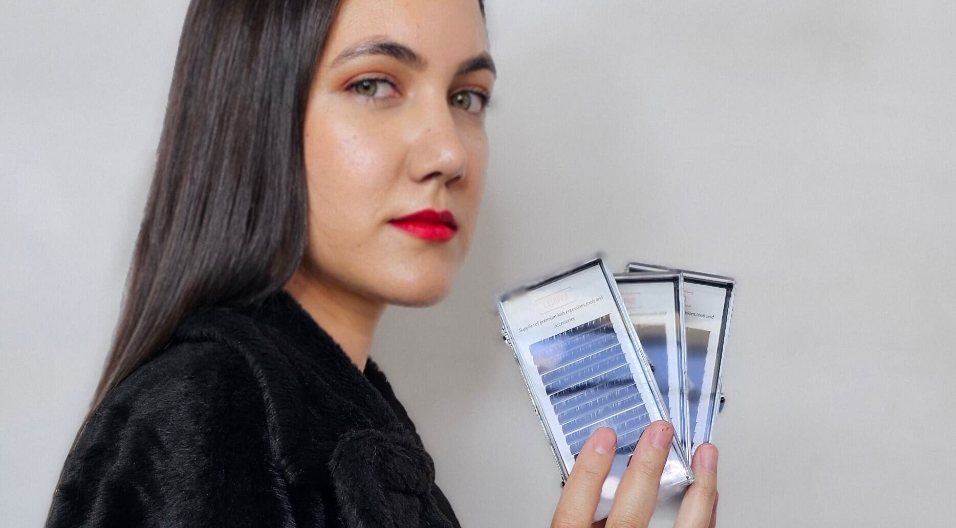 Woman holding eyelash trays at Lashcore | Rondebosch East in Cape Town, Western Cape, ZA.