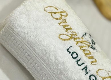 Embroidered towel at Brazilian Beauty Lounge in Vaughan, Ontario, CA, signifies elegance and comfort.