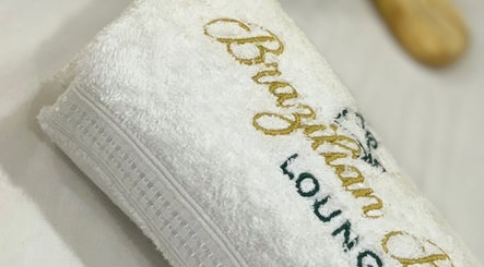 Embroidered towel at Brazilian Beauty Lounge in Vaughan, Ontario, CA, signifies elegance and comfort.