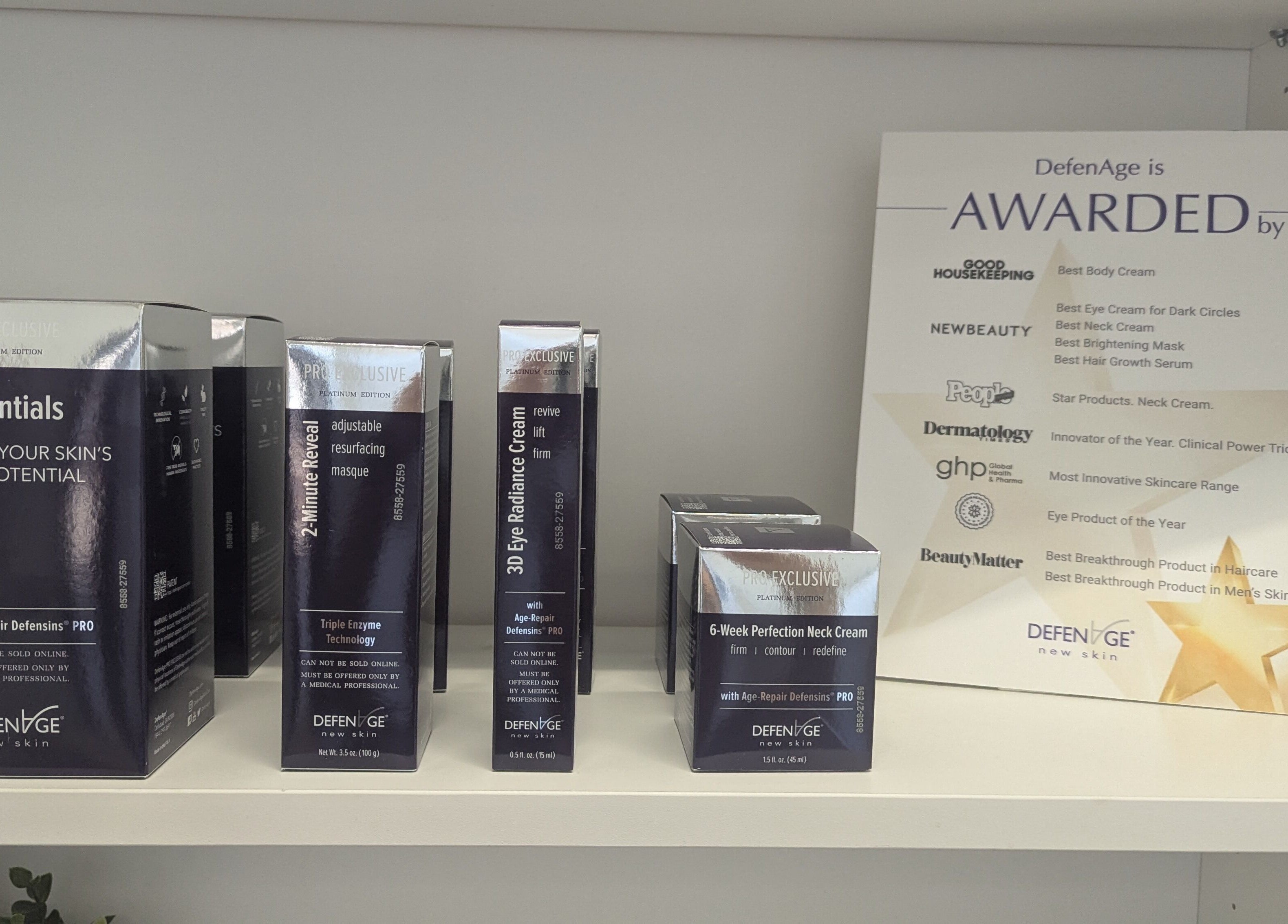 DefenAge skincare products and awards display at West Valley Aesthetics, Glendale, Arizona, US.