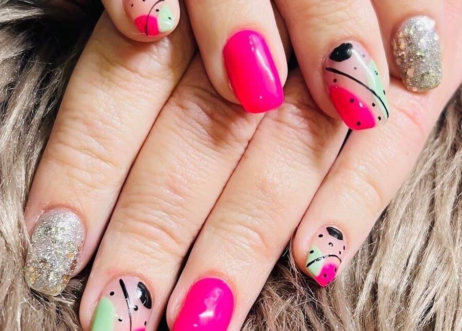 Brightly designed nails with pink and green details at Bespoke Nails, Krugersdorp, Gauteng, ZA.