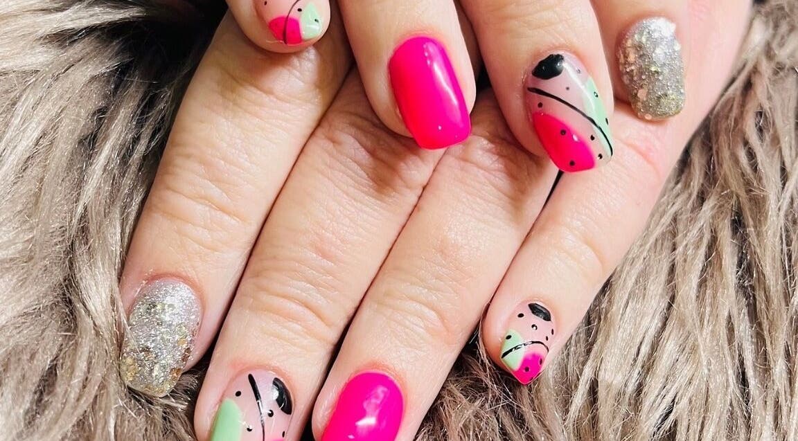 Brightly designed nails with pink and green details at Bespoke Nails, Krugersdorp, Gauteng, ZA.