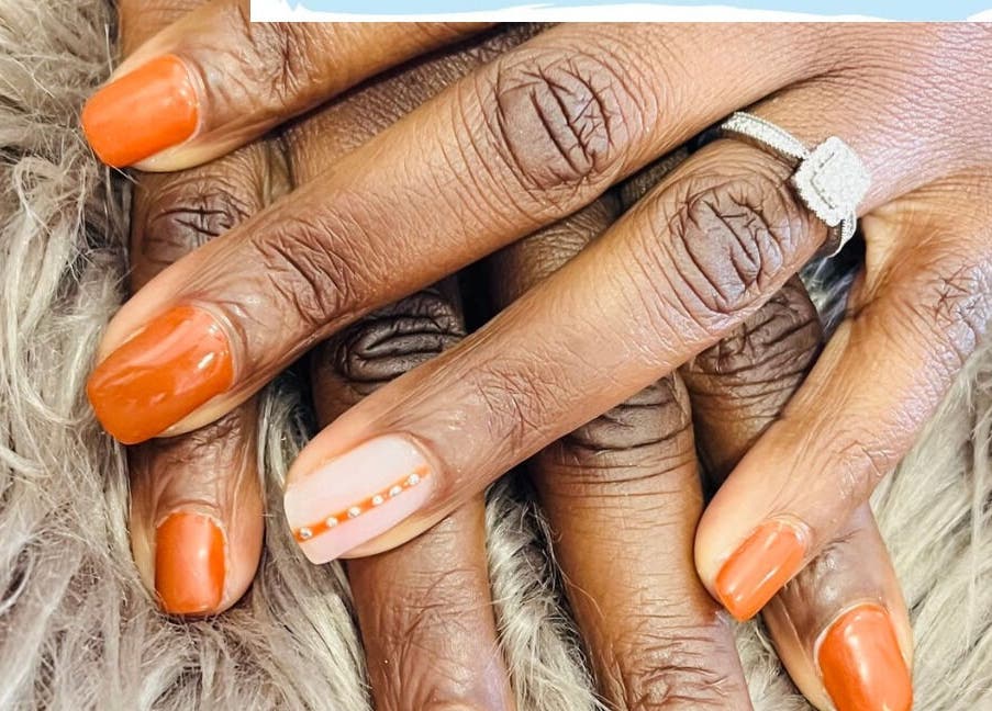 Elegant orange manicured nails at Bespoke Nails, Krugersdorp, Gauteng, ZA.