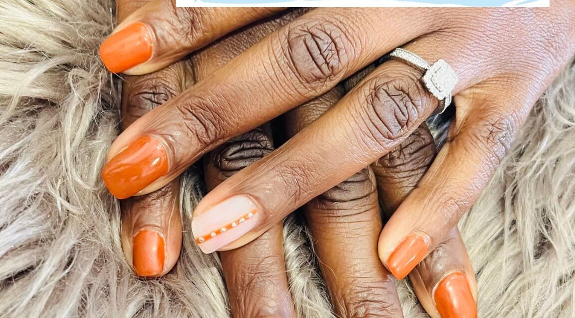 Elegant orange manicured nails at Bespoke Nails, Krugersdorp, Gauteng, ZA.