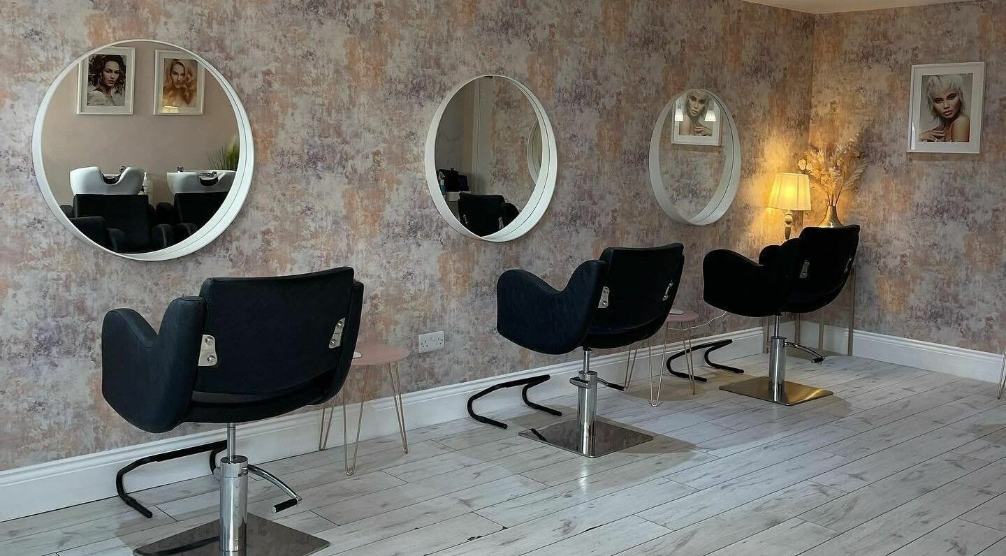 Stylish salon chairs and mirrors inside Célfie, Derby, England, GB, offering a modern beauty experience.
