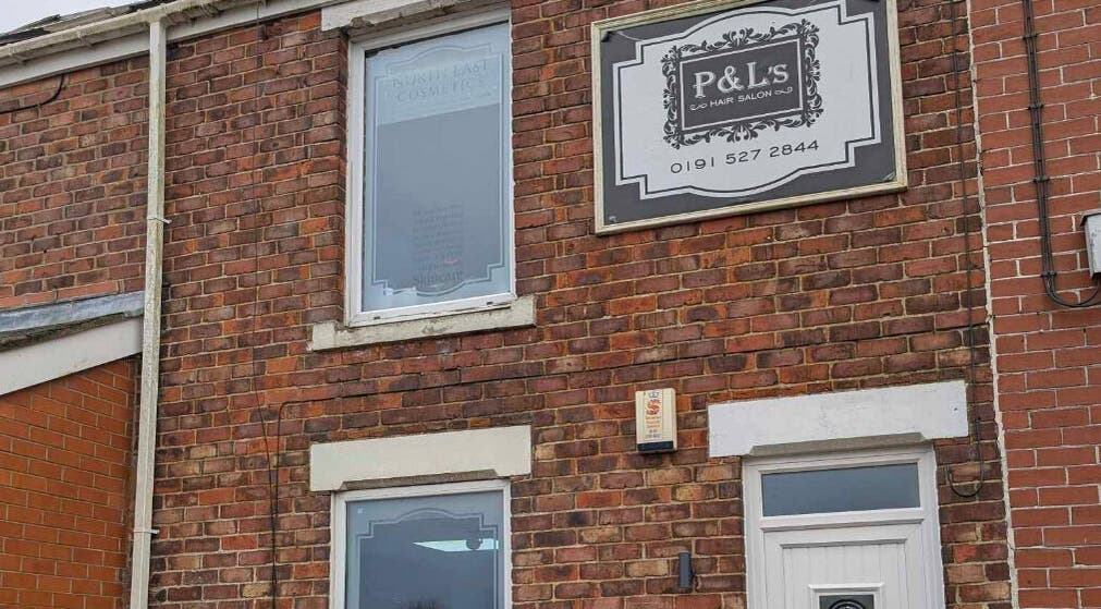 North East Cosmetics [Easington Village] exterior in Peterlee, England. Features a classic brick facade and signage.
