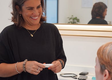 Consultation at Dr Meera Aesthetics - Glasgow, featuring joyful interaction. Glasgow, Scotland, GB.