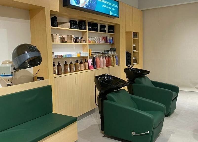 Modern salon interior at Raw Beauty Salon, Abu Dhabi, AE, featuring sleek shampoo stations.