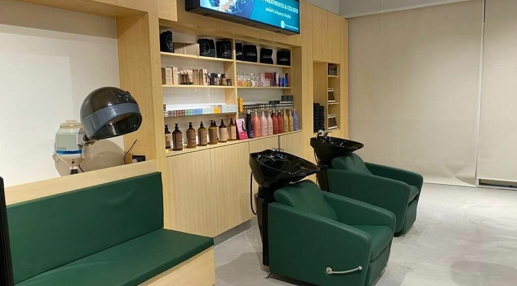 Modern salon interior at Raw Beauty Salon, Abu Dhabi, AE, featuring sleek shampoo stations.