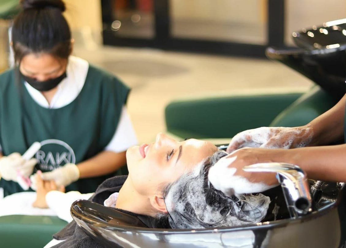 Relaxing hair wash at Raw Beauty Salon, Abu Dhabi, AE. Experience soothing and luxurious care in a serene environment.