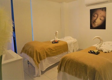 Relaxing massage room at Evaiya Spa, Surfers Paradise, Queensland, AU with cozy beds and calming decor.