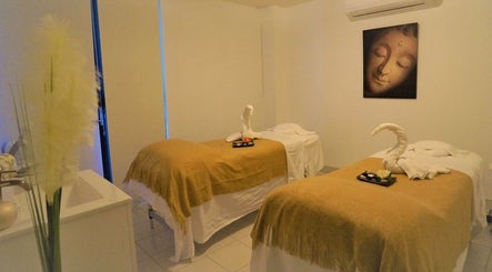 Relaxing massage room at Evaiya Spa, Surfers Paradise, Queensland, AU with cozy beds and calming decor.