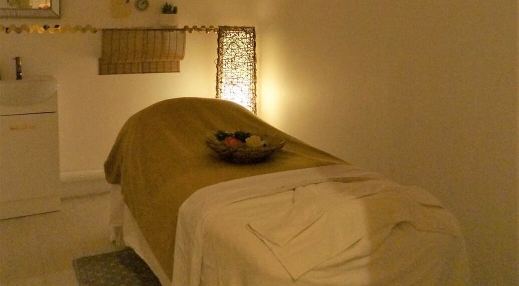 Relaxing massage room at Evaiya Spa, Surfers Paradise, Queensland, AU offers a serene ambiance for wellness.