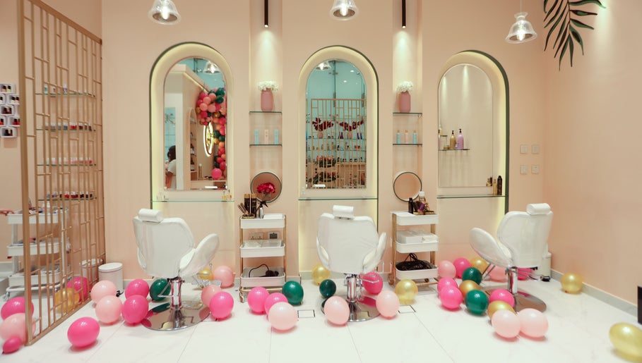 Elegant interior of Cuts and Nails Beauty Salon - Home Service in Dubai, AE with colorful balloons and stylish decor.
