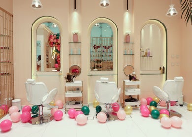 Elegant interior of Cuts and Nails Beauty Salon - Home Service in Dubai, AE with colorful balloons and stylish decor.
