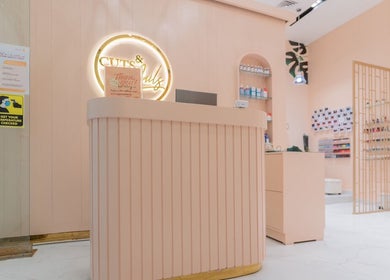 Reception area of Cuts and Nails Beauty Salon - Home Service in Dubai, AE with warm lighting and elegant decor.