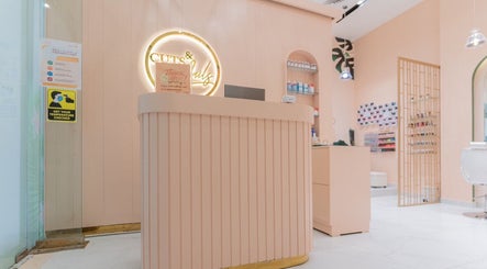Reception area of Cuts and Nails Beauty Salon - Home Service in Dubai, AE with warm lighting and elegant decor.