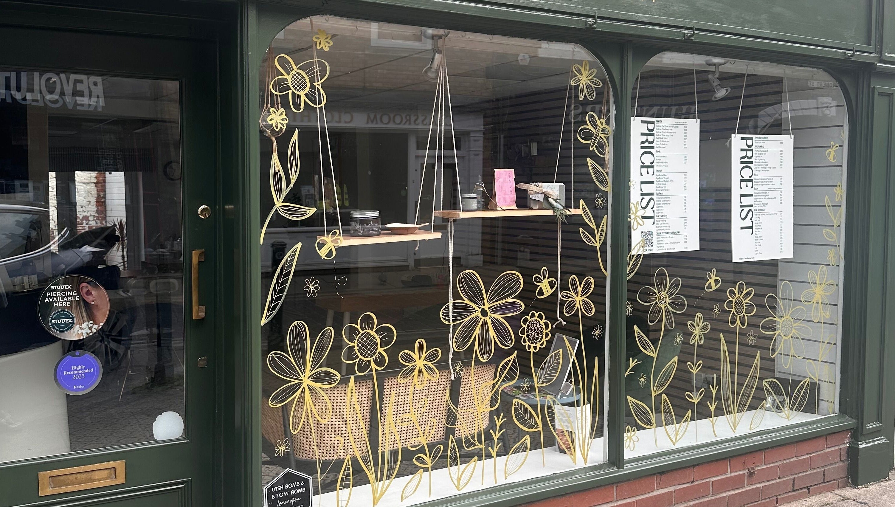 Blossom Advanced Beauty's vibrant floral window display in Selby, England, GB enhances their storefront appeal.
