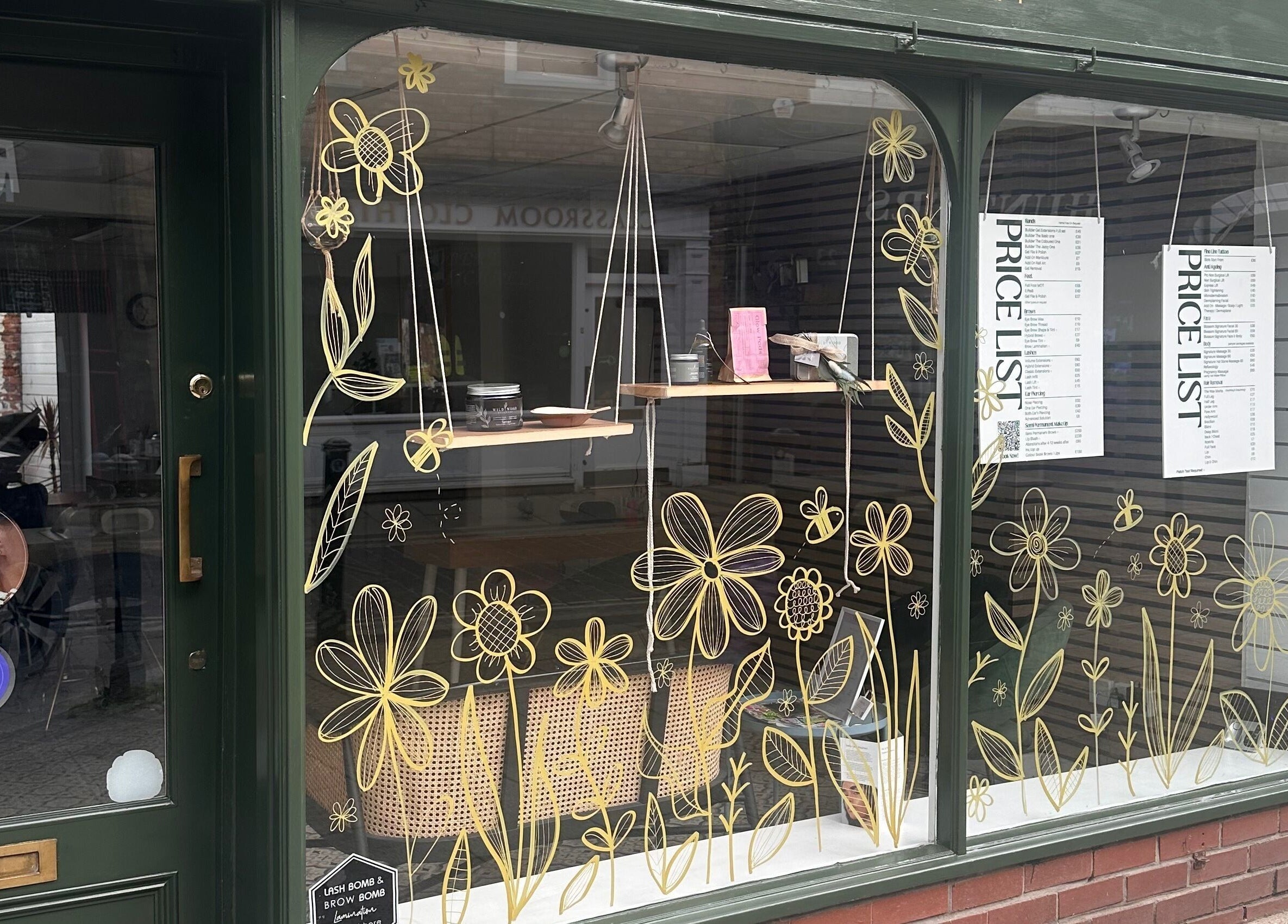 Blossom Advanced Beauty's vibrant floral window display in Selby, England, GB enhances their storefront appeal.