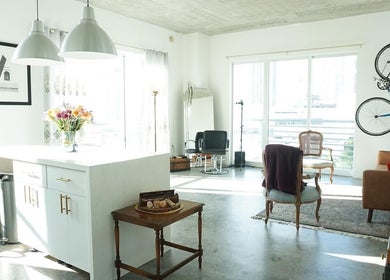 Bright, modern interior of Sodada Salon in Miami, Florida, US featuring chic furniture and large windows.