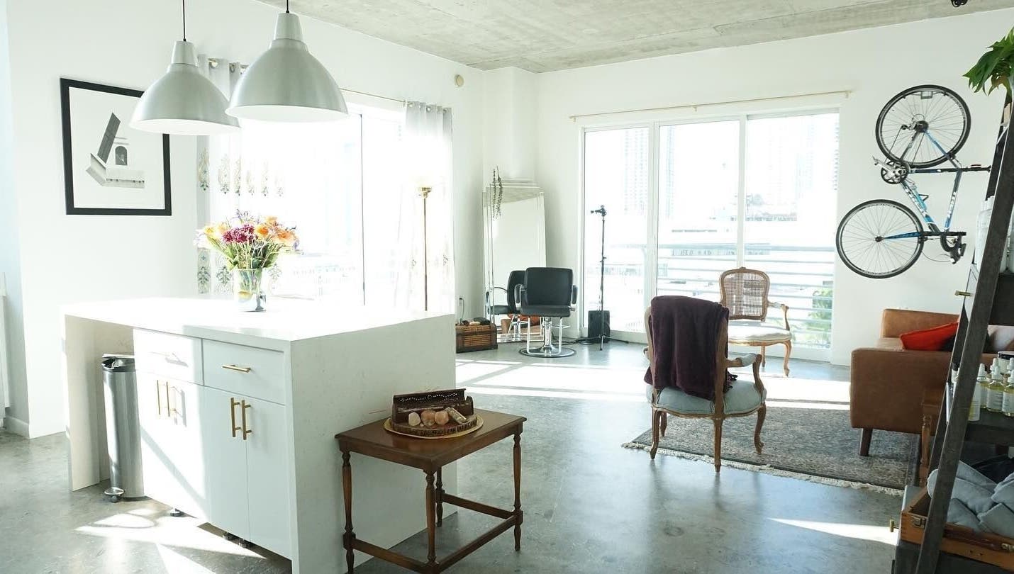 Sunlit interior of Sodada Salon in Miami, Florida, US featuring stylish decor and modern salon chairs.