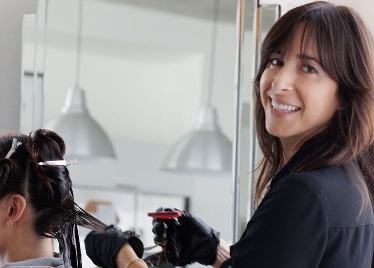 Professional stylist working with client at Sodada Salon, Miami, Florida, US, enhancing client experience.