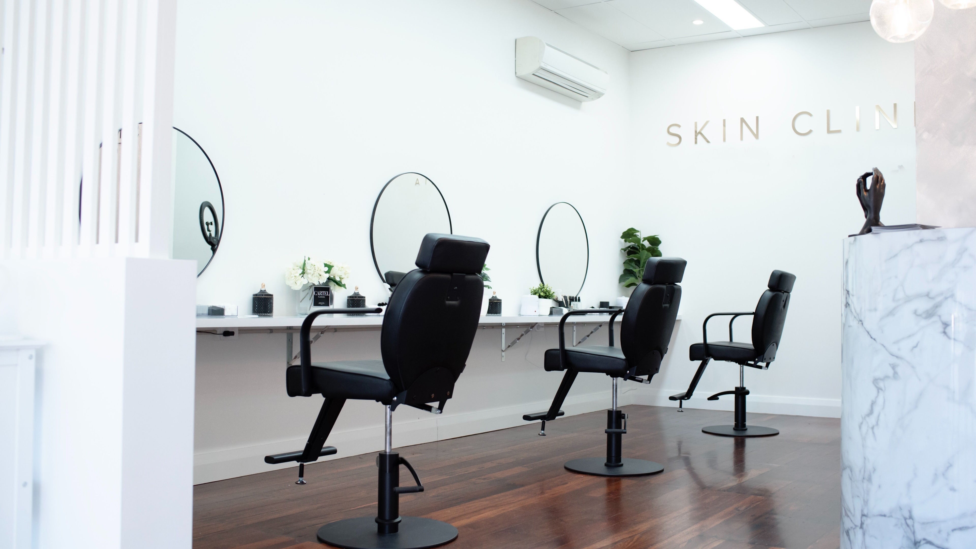 Stylish interior of Skin Room Perth with modern chairs and mirrors in Mount Lawley, Western Australia, AU.