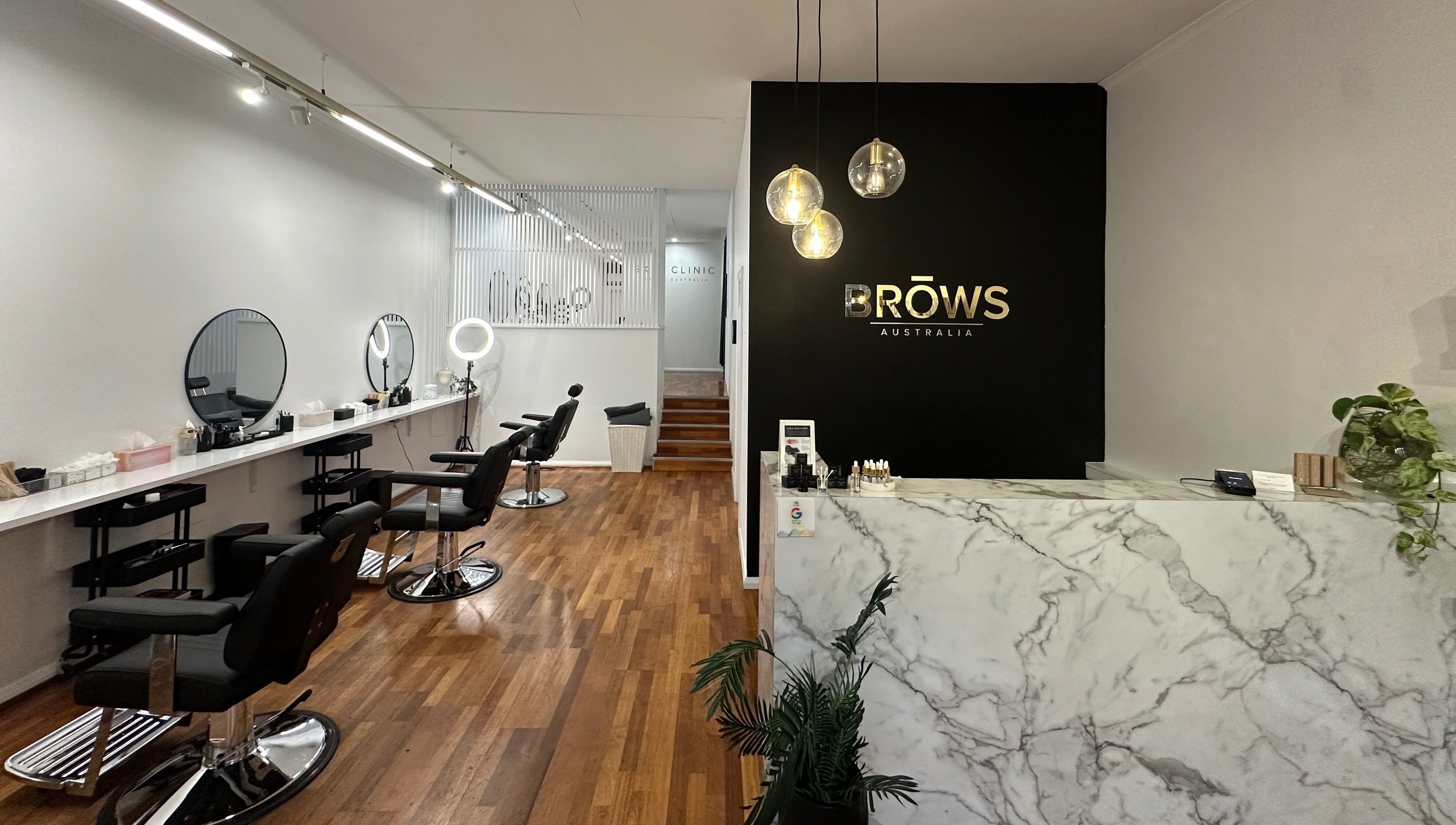 Stylish interior of Brows Australia - Launceston, featuring chic chairs and a marble counter in Launceston, Tasmania, AU.