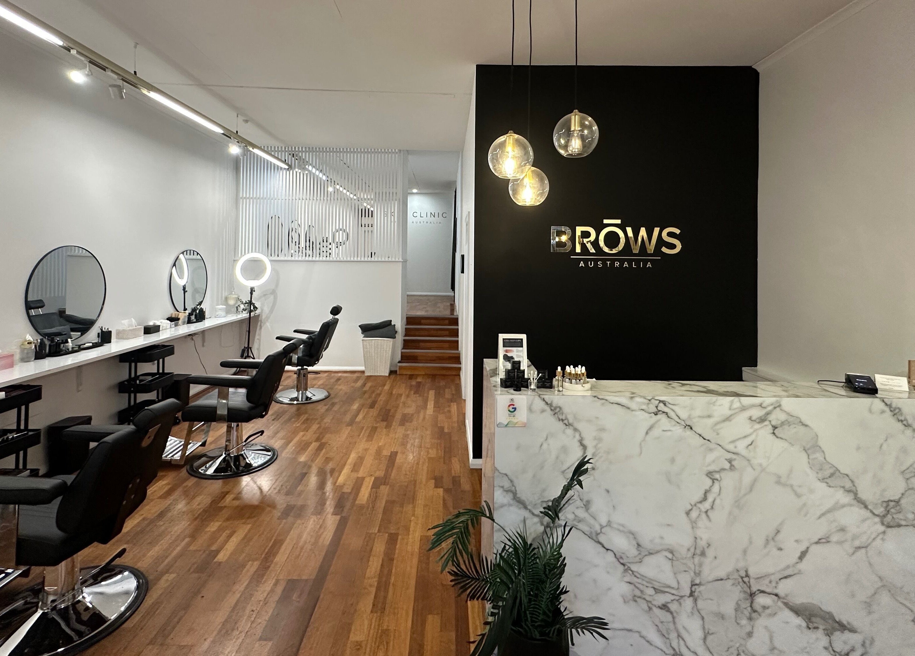 Stylish interior of Brows Australia - Launceston, featuring chic chairs and a marble counter in Launceston, Tasmania, AU.