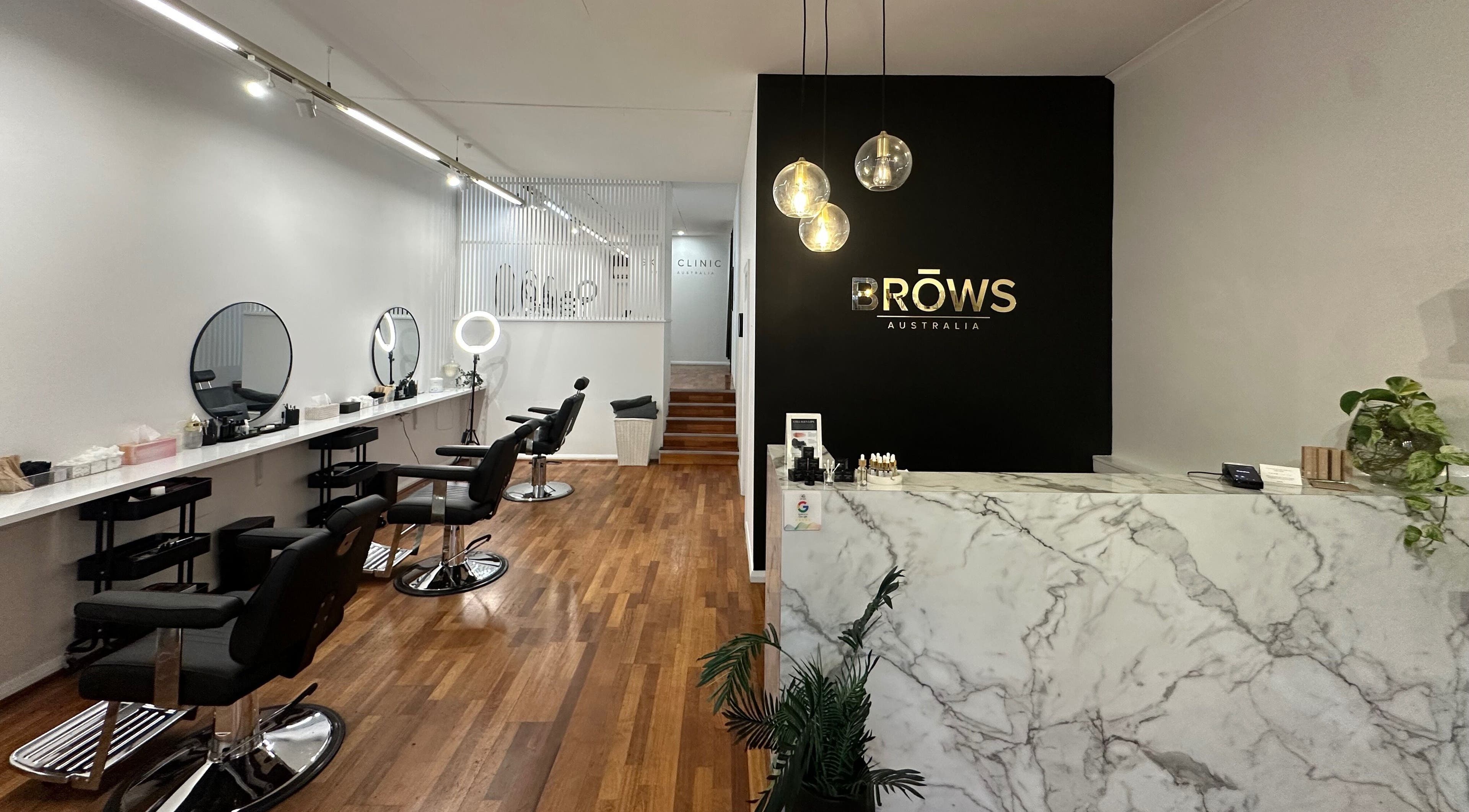 Stylish interior of Brows Australia - Launceston, featuring chic chairs and a marble counter in Launceston, Tasmania, AU.