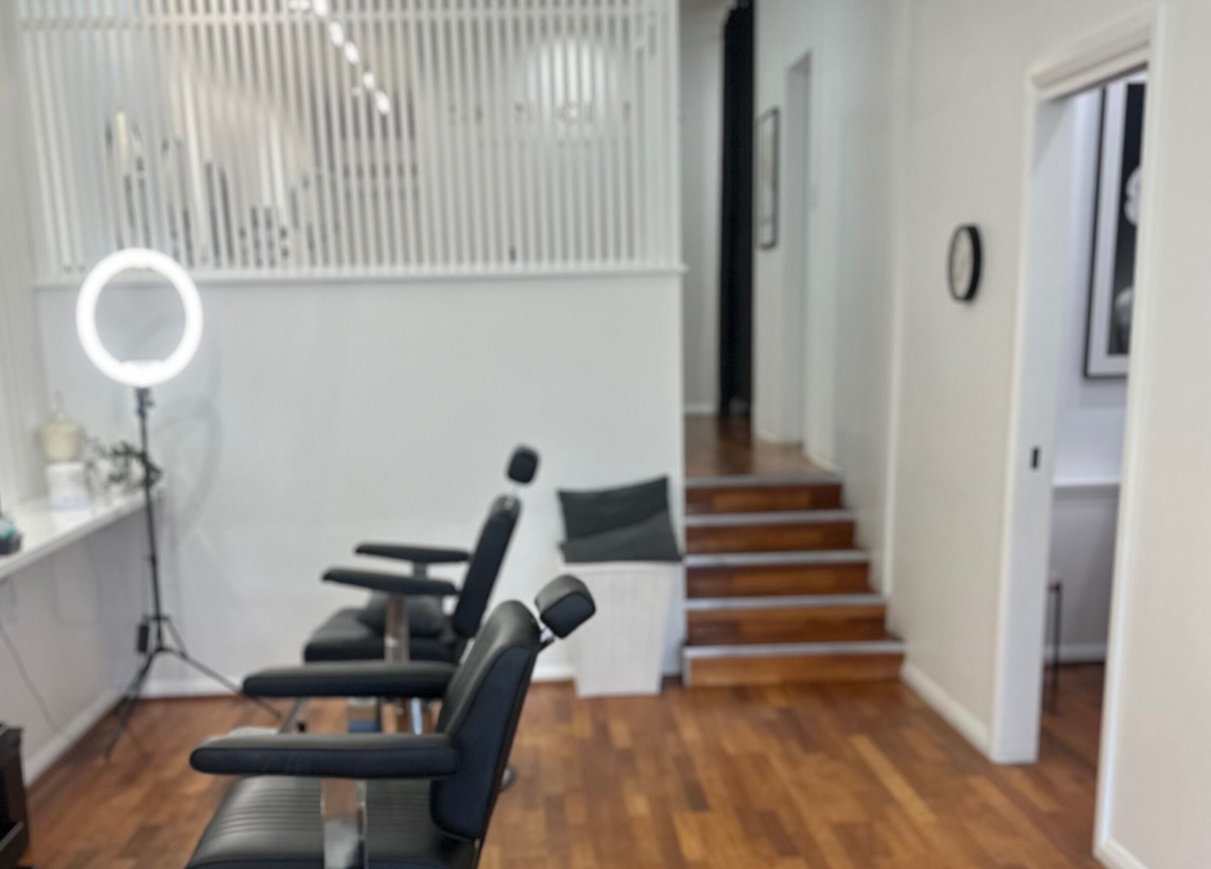 Modern salon interior at Brows Australia - Launceston, featuring elegant chairs and lighting, Launceston, Tasmania, AU.