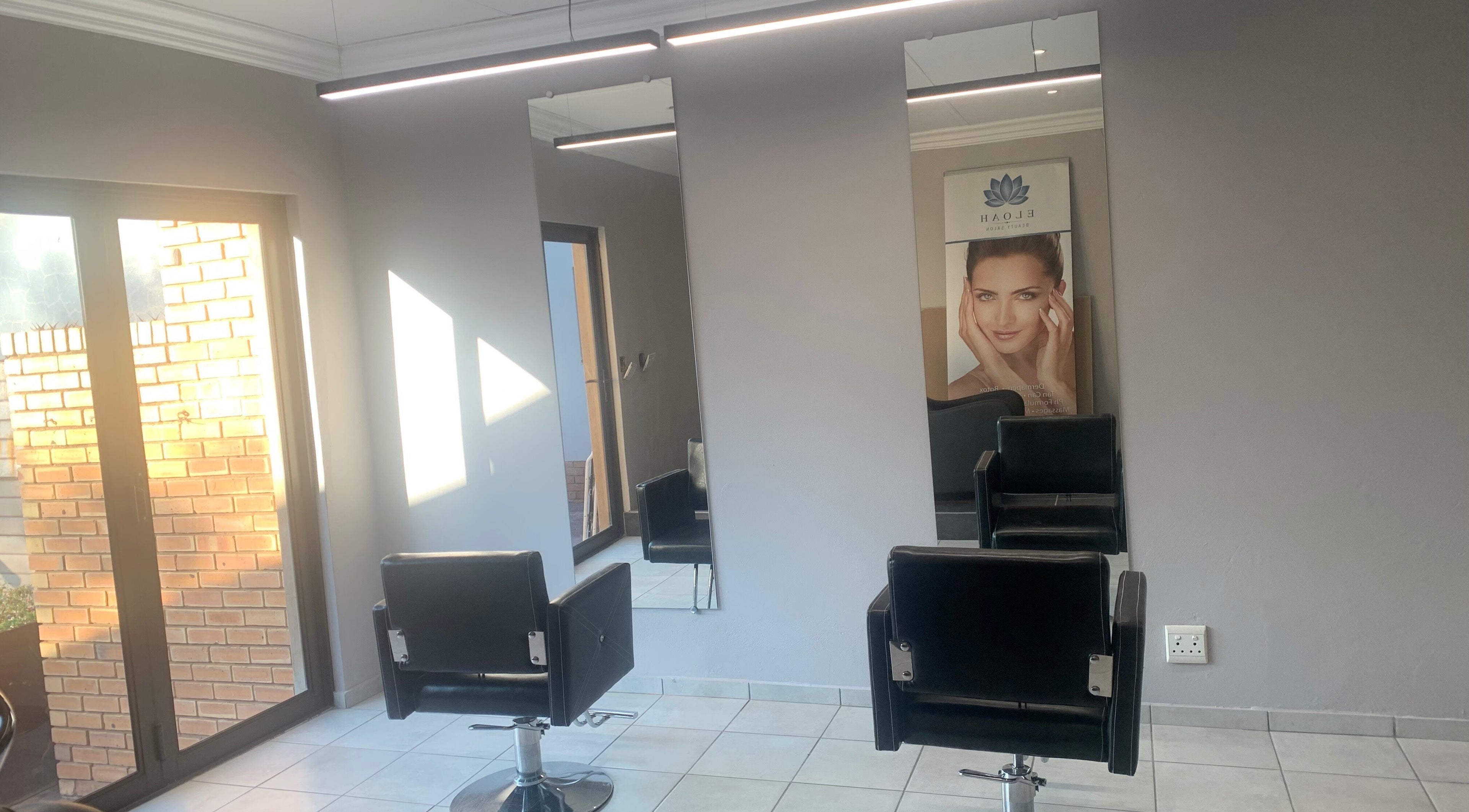 Modern salon chairs and mirrors at Eloah Aesthetic Clinic & Salon - Rooihuiskraal, Centurion, Gauteng, ZA.