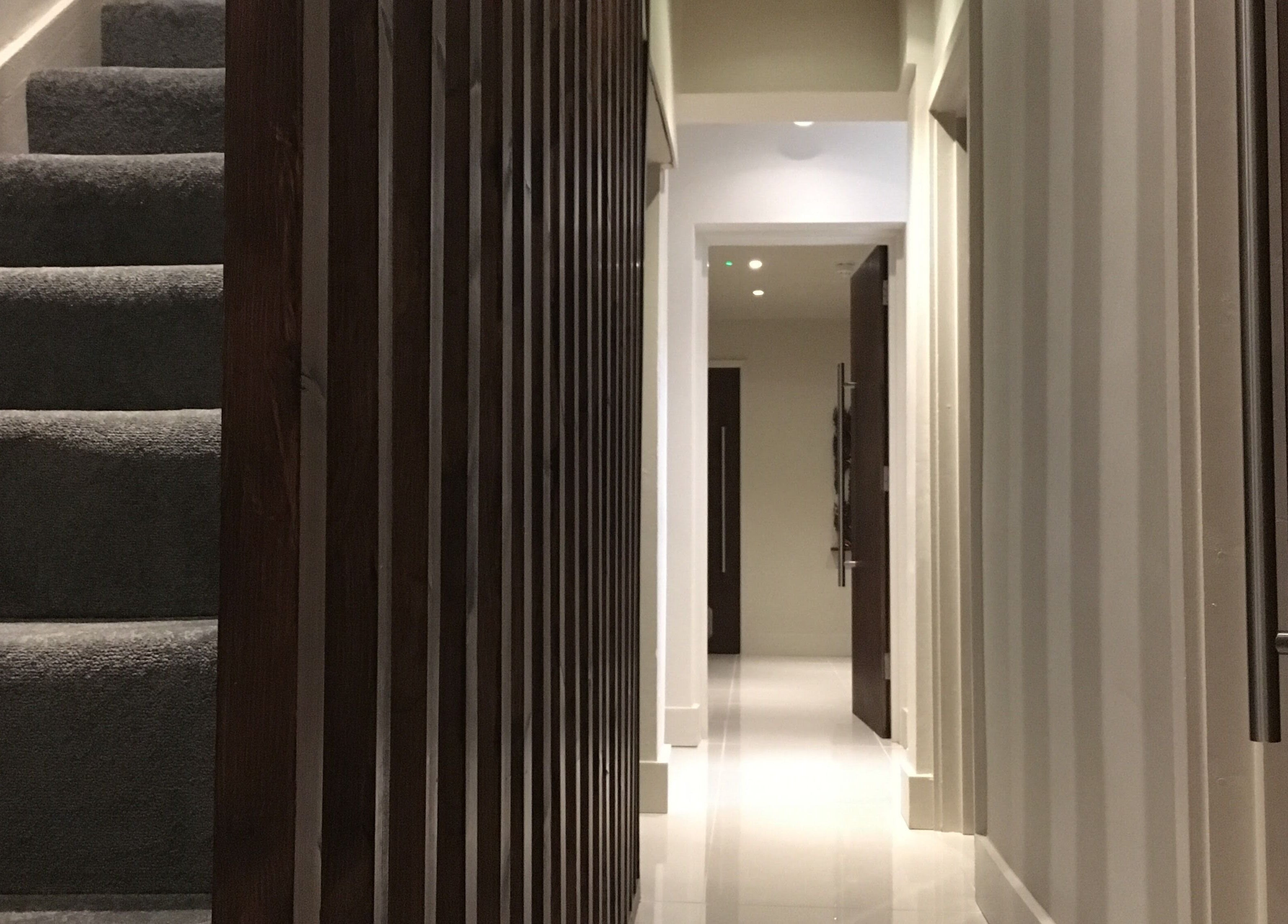 Modern hallway at Thy Spa Oxford featuring soft lighting and sleek design, Oxford, England, GB.