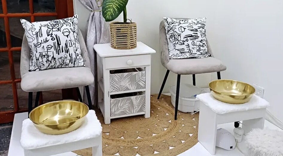 Chic pedicure setup at Salon Beautè in Hillcrest, Kwazulu-natal, ZA with gold bowls and stylish decor.