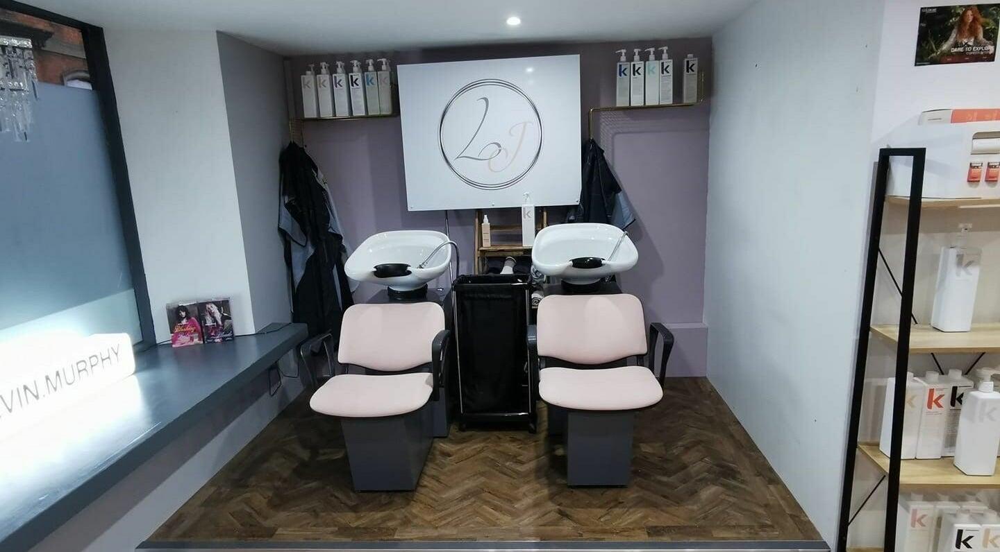 Hair washing area at Lucy Jorge in Langport, England, GB with stylish chairs and products.
