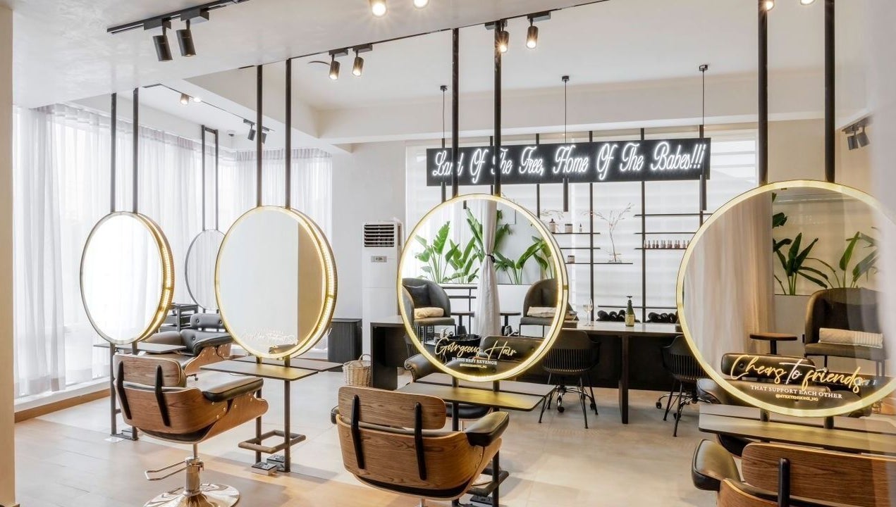 Interior view of My Extensionz salon in Lagos, Lagos, NG with elegant styling stations and modern decor.