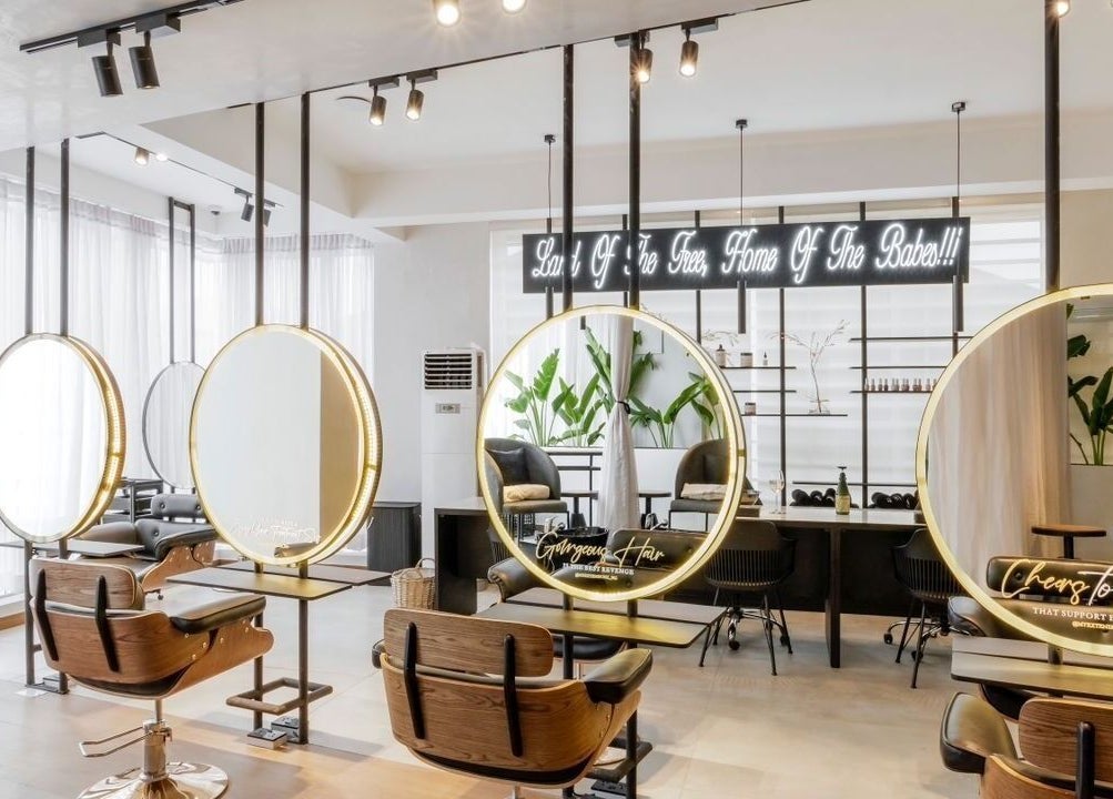 Interior view of My Extensionz salon in Lagos, Lagos, NG with elegant styling stations and modern decor.