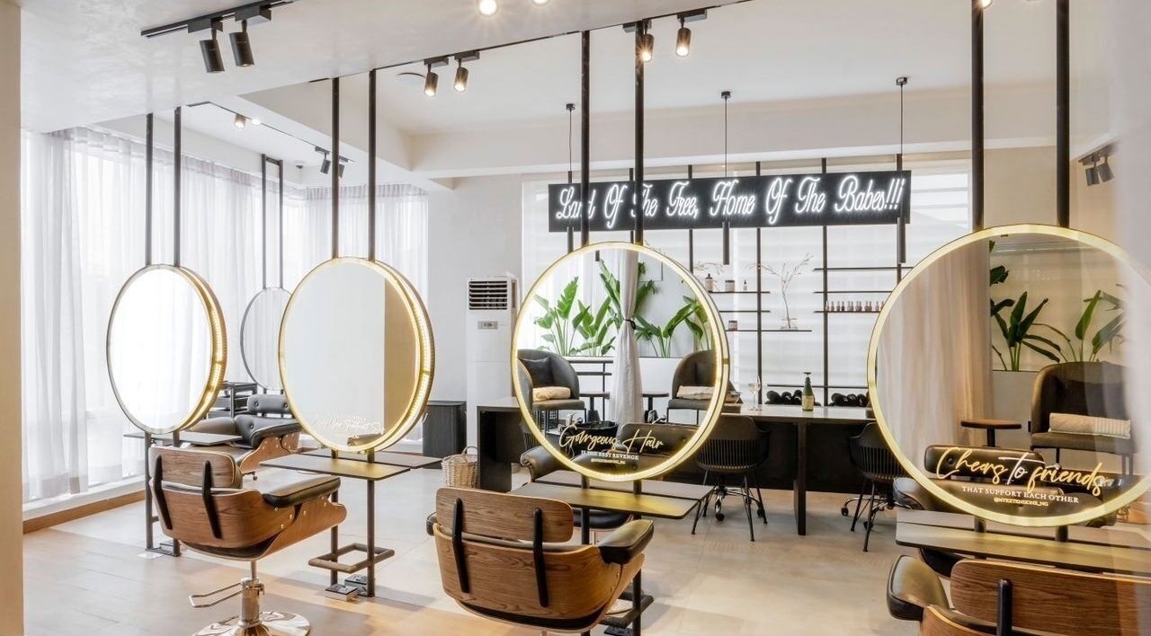 Interior view of My Extensionz salon in Lagos, Lagos, NG with elegant styling stations and modern decor.